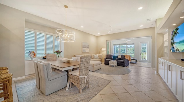 dining area featuring light tile patterned floors, recessed lighting, visible vents, baseboards, and ceiling fan with notable chandelier