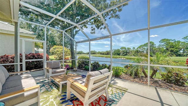 sunroom featuring a swimming pool, a healthy amount of sunlight, and a water view