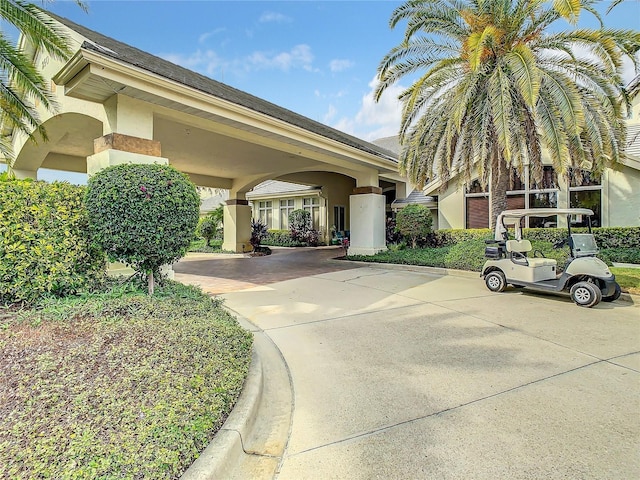 exterior space with concrete driveway