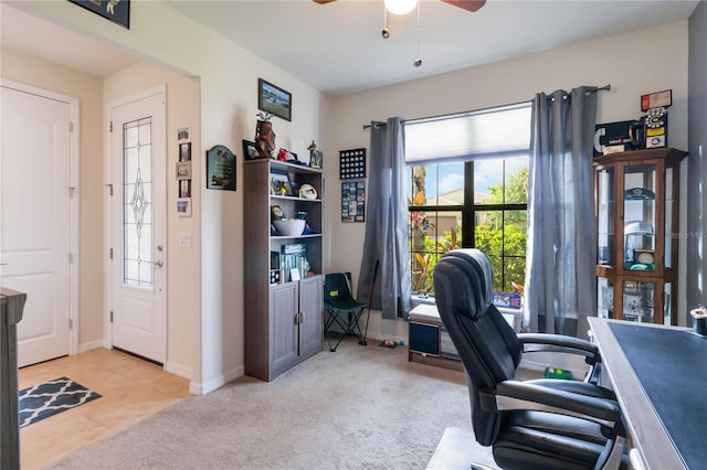 office area with ceiling fan, light colored carpet, and a wealth of natural light