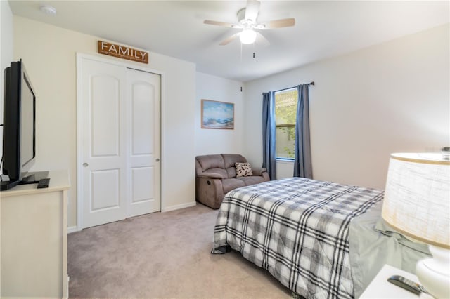 carpeted bedroom featuring ceiling fan