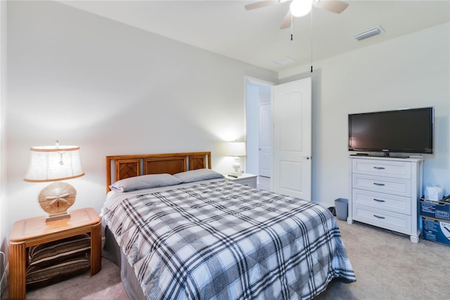 bedroom featuring light colored carpet and ceiling fan