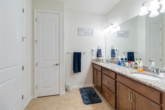 bathroom with vanity and tile patterned floors