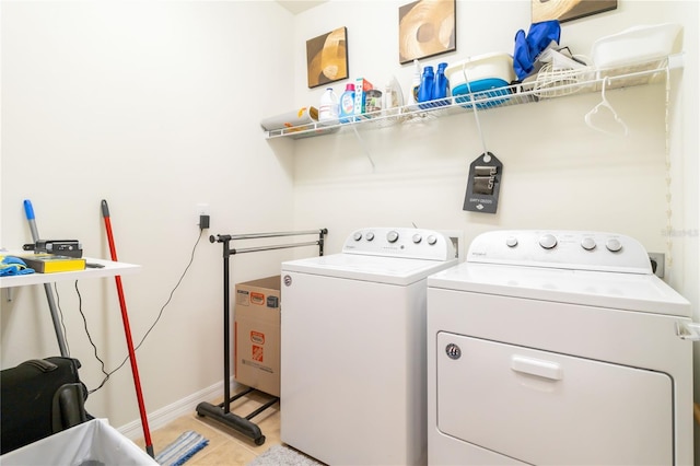 washroom with washer and dryer