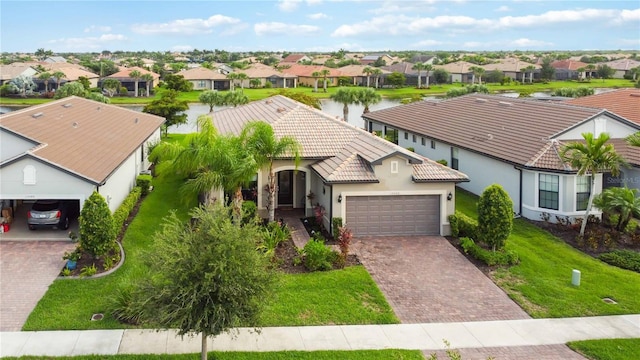 view of front of property featuring a garage and a front yard