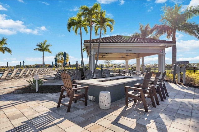 view of patio / terrace featuring a gazebo and an outdoor fire pit