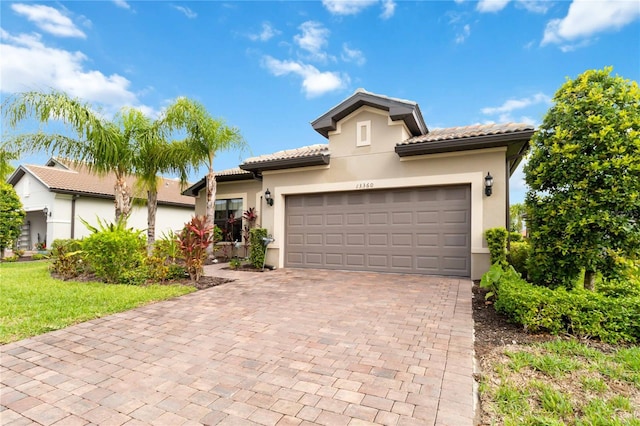 mediterranean / spanish house featuring a garage