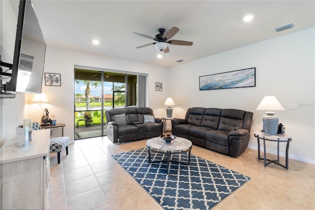 tiled living room featuring ceiling fan