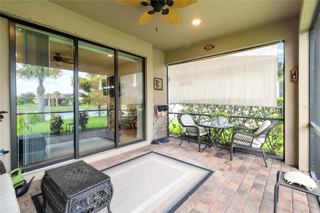 sunroom / solarium with ceiling fan