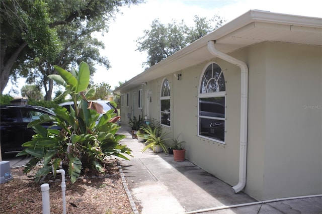 view of property exterior with a patio