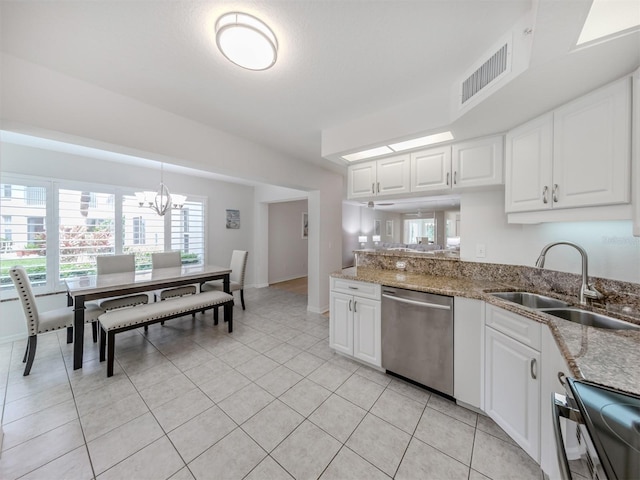 kitchen featuring dishwasher, an inviting chandelier, white cabinetry, and sink