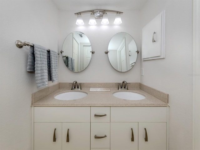 full bathroom with a sink and double vanity