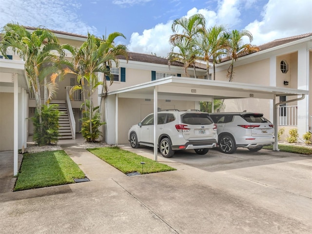 view of vehicle parking featuring a carport