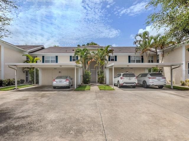 view of front of property featuring a carport