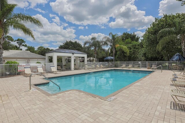 view of swimming pool with a patio