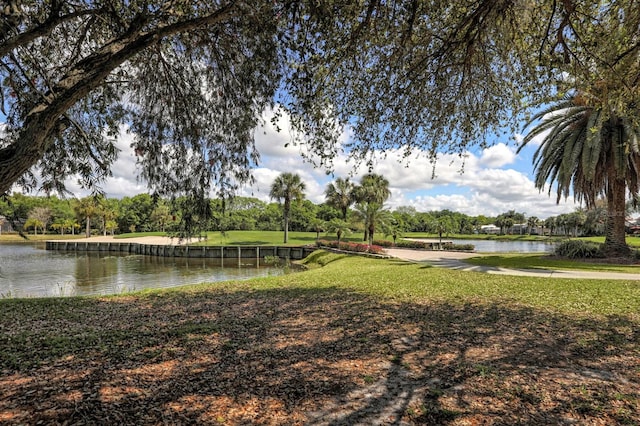 exterior space featuring a water view and a yard