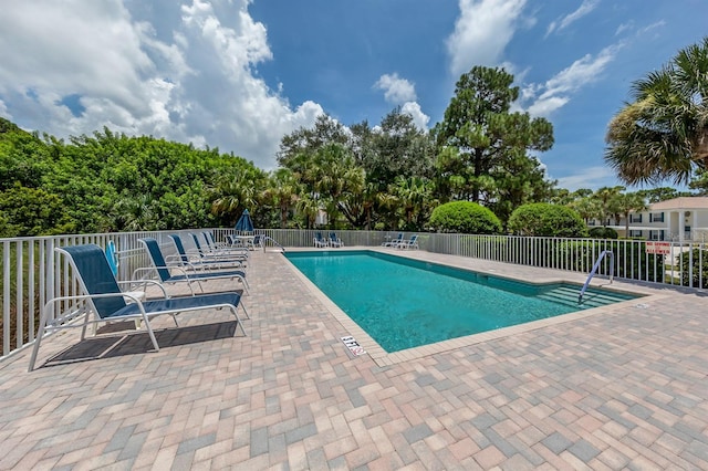 view of swimming pool featuring a patio