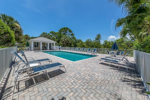 view of swimming pool featuring a patio area