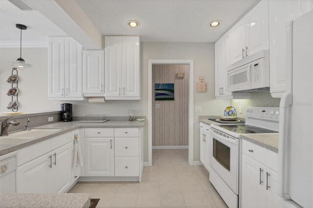 kitchen featuring decorative light fixtures, white appliances, white cabinets, and light tile floors