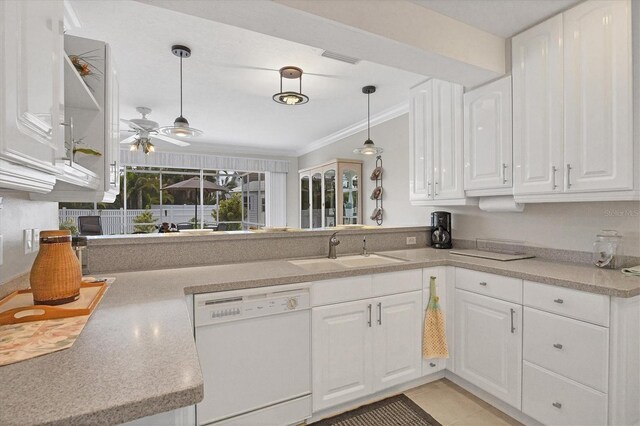 kitchen with decorative light fixtures, white cabinetry, ornamental molding, white dishwasher, and sink