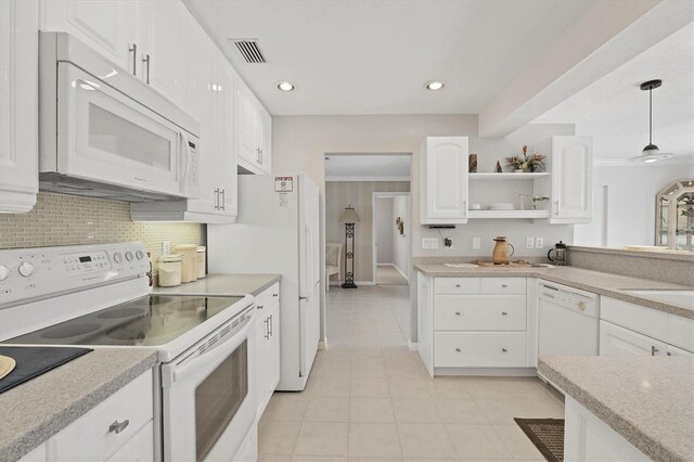 kitchen with light tile flooring, crown molding, white cabinets, white appliances, and pendant lighting