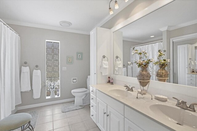 bathroom with double sink, tile floors, ornamental molding, toilet, and large vanity