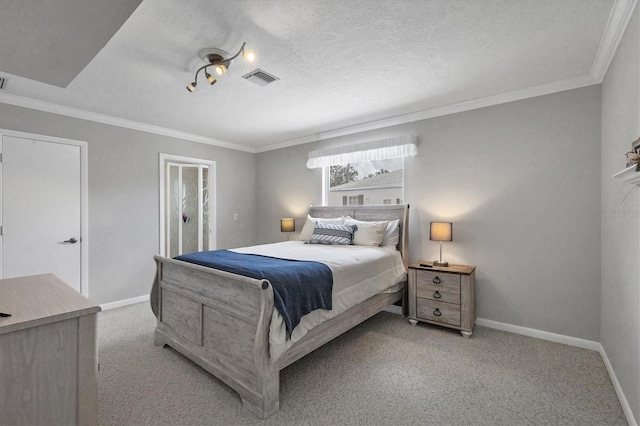 carpeted bedroom featuring ornamental molding and a textured ceiling