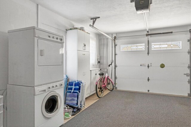 laundry area featuring carpet and stacked washer / dryer