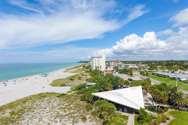 birds eye view of property with a view of the beach and a water view