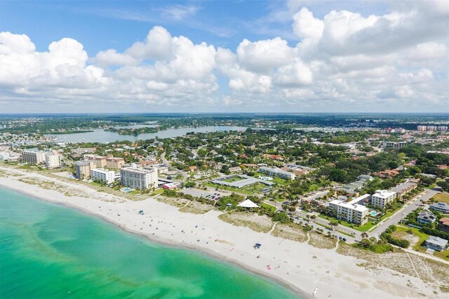 bird's eye view featuring a beach view and a water view