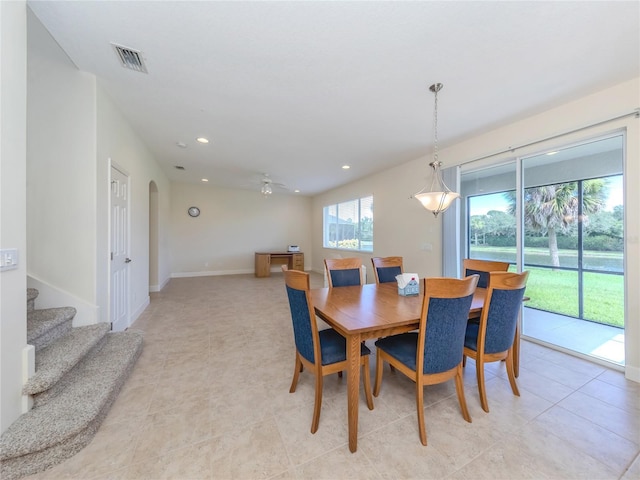 dining area with light tile patterned flooring, ceiling fan, and a wealth of natural light