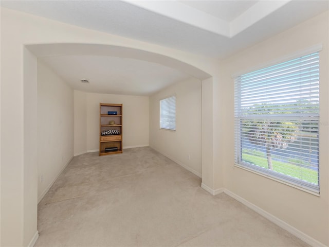 empty room featuring light carpet