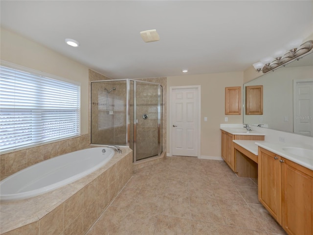 bathroom with tile patterned flooring, separate shower and tub, and vanity