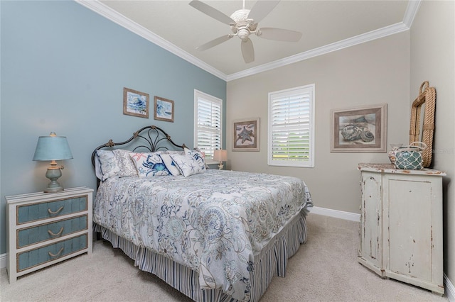 carpeted bedroom featuring ceiling fan and crown molding