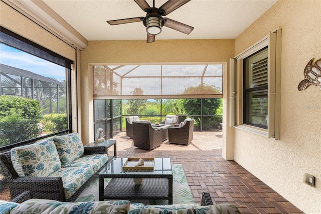 sunroom / solarium with ceiling fan