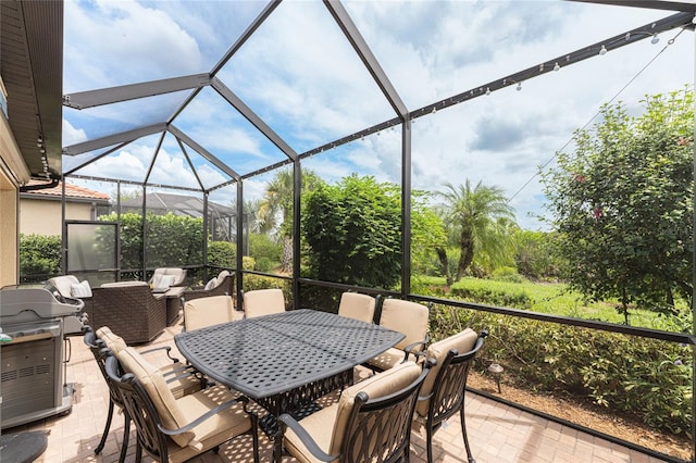 view of patio / terrace featuring a lanai and area for grilling