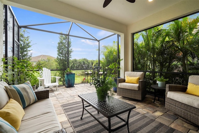 sunroom featuring plenty of natural light and a ceiling fan