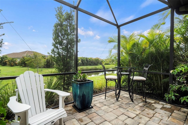 sunroom with a water view