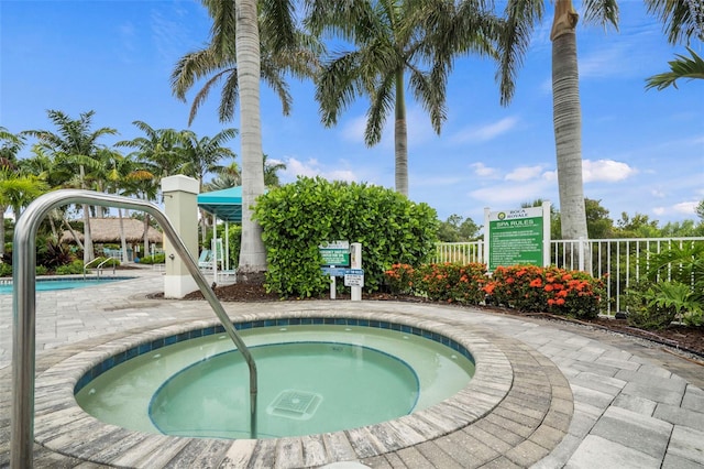 view of pool featuring a hot tub