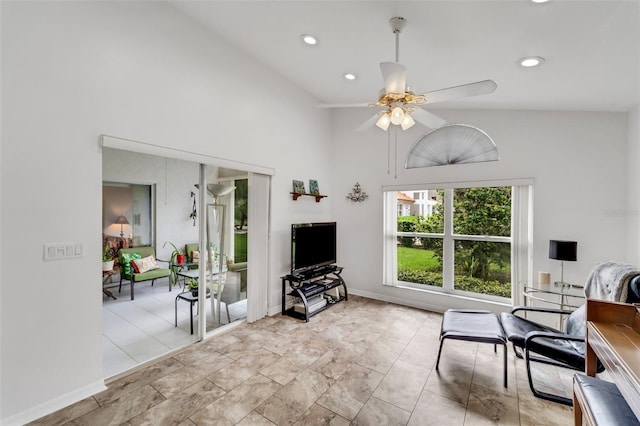 living room featuring ceiling fan and high vaulted ceiling