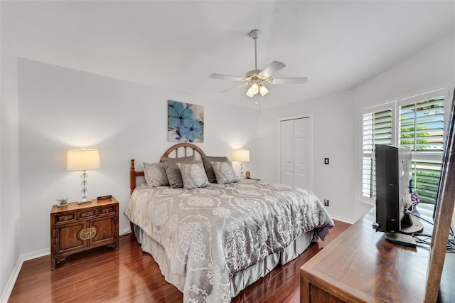 bedroom with hardwood / wood-style flooring, ceiling fan, and a closet