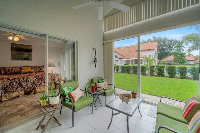 sunroom featuring ceiling fan