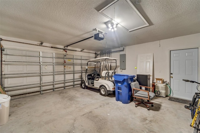 garage featuring electric panel and a garage door opener