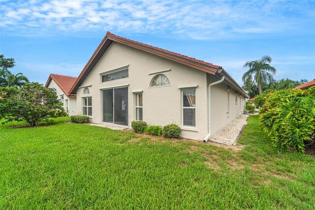 rear view of house with a lawn