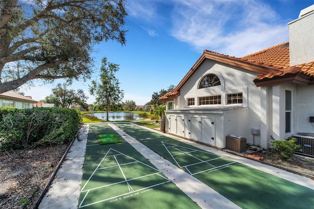 view of home's community featuring a water view