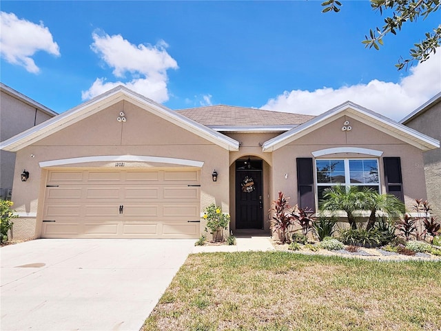 ranch-style home featuring a garage and a front lawn