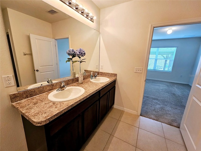 bathroom with tile patterned flooring and vanity