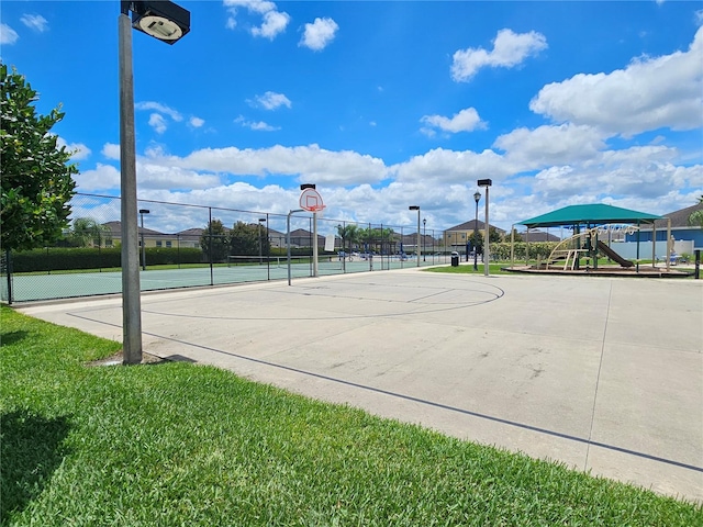 view of basketball court featuring a playground, a yard, and tennis court