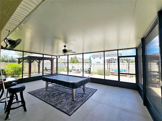 sunroom with ceiling fan and pool table