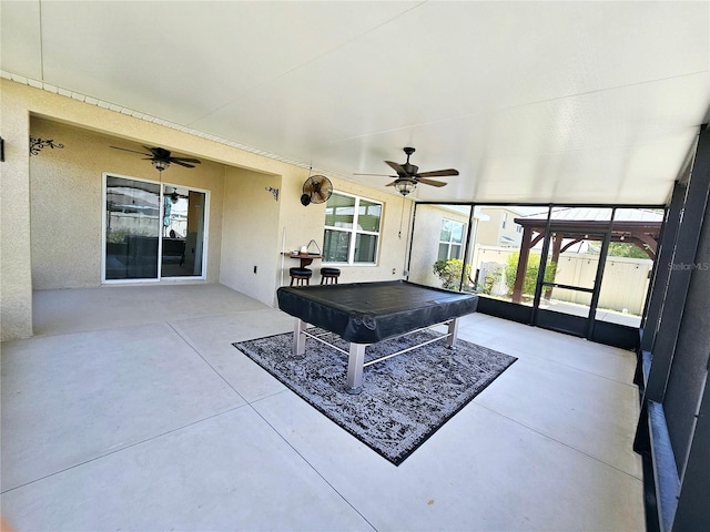 playroom with concrete flooring, ceiling fan, and pool table